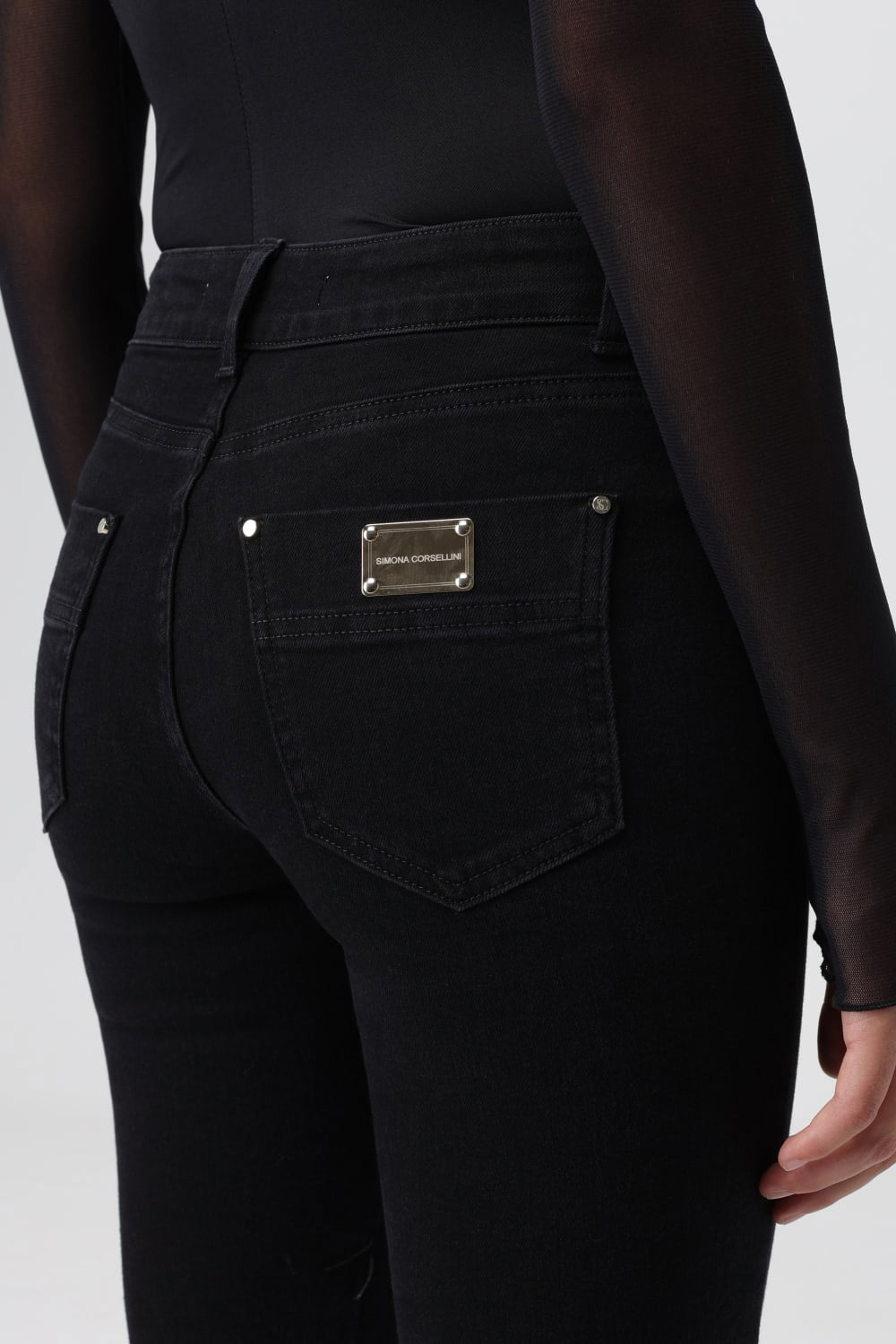 SIMONA CORSELLINI Jeans con dettaglio chiodi SIMONA CORSELLINI